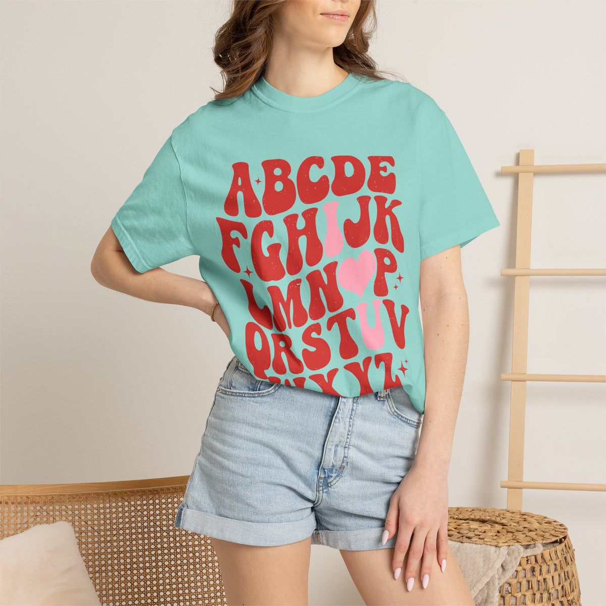 Retro Heart Alphabet T‑Shirt — Groovy Red Lettering Tee with Heart Accent